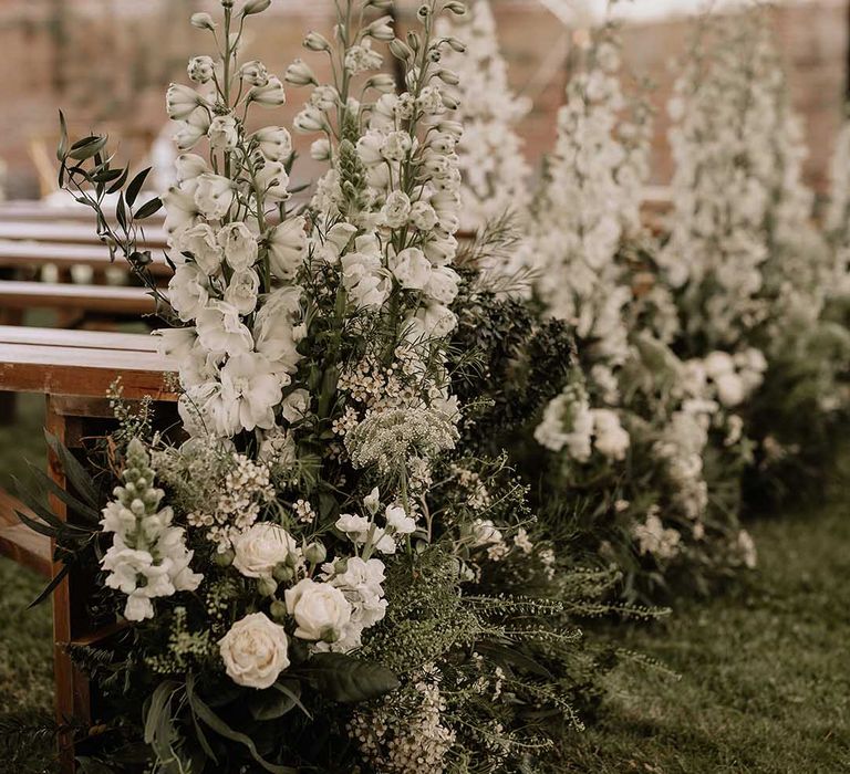 Classic tall white wedding flower aisle decoration for traditional style outdoor wedding 