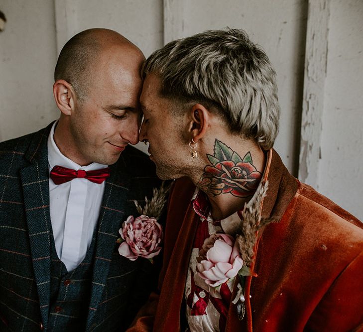 Grooms wear homemade floral buttonholes on their wedding day