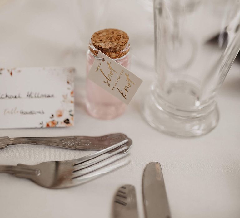 Mini cork bottle wedding favours of a shot for the wedding guests