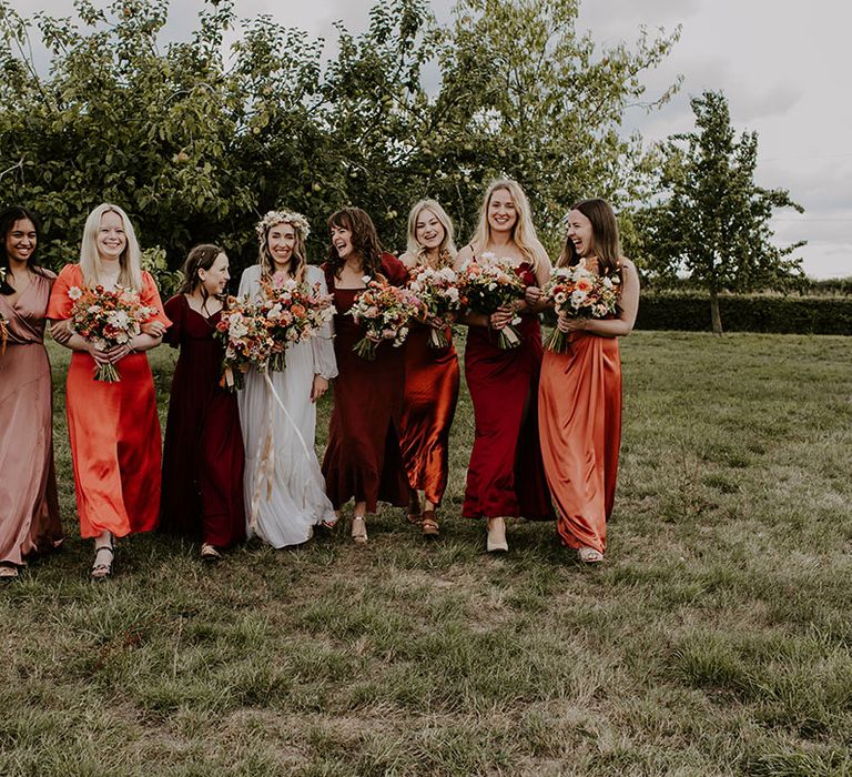 Bridesmaids wear Autumnal colour bridesmaid dresses in mismatched styles