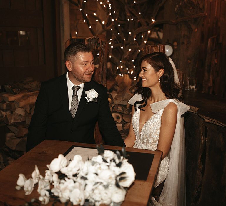 The bride and groom gaze into each other's eyes for their rustic wedding at Alnwick Treehouse 