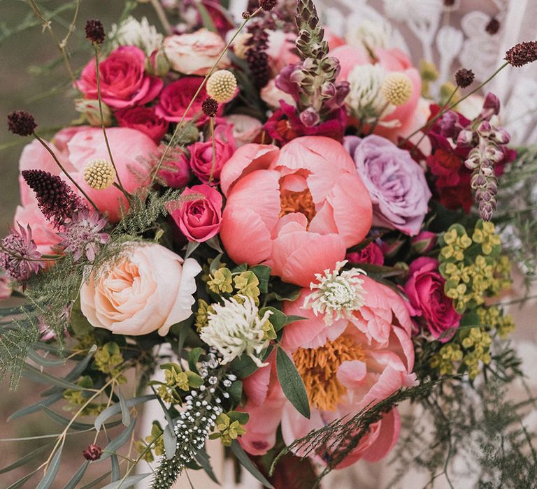 Pink wedding flower bouquet with peonies, roses, and more 