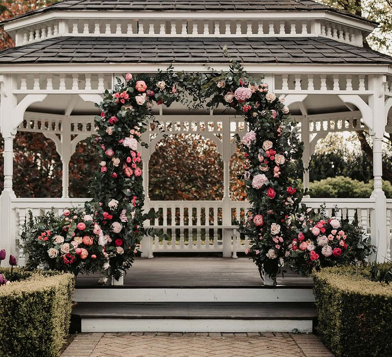 Pink flower arch decoration for outdoor wedding 