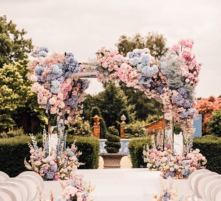 Four Seasons Hampshire outdoor wedding ceremony decorated with mirror cabana, aisle and pastel wedding flowers 