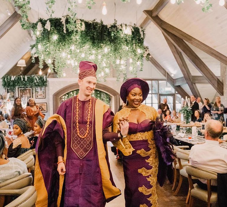 Traditional Yoruba purple and gold wedding outfits for the bride and groom 