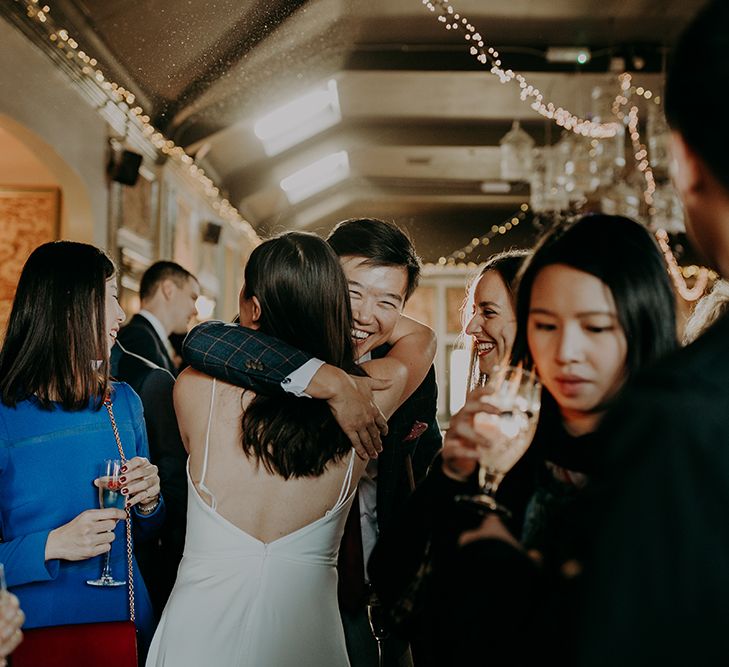 Wedding guest embraces