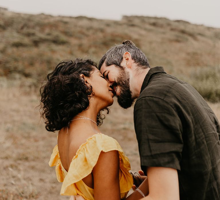 Bride and groom kissing at at coastal elopement 