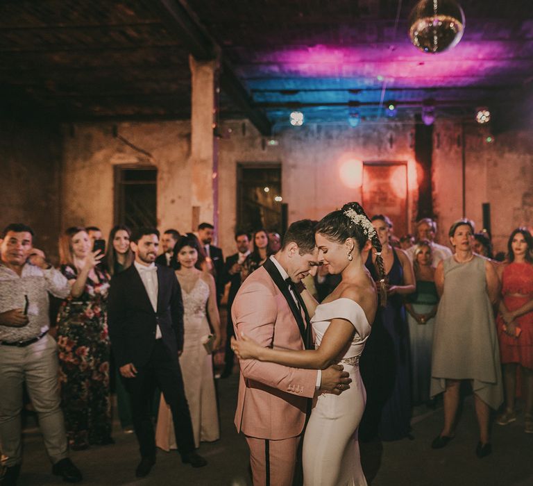 Bride and groom first dance at industrial warehouse wedding 