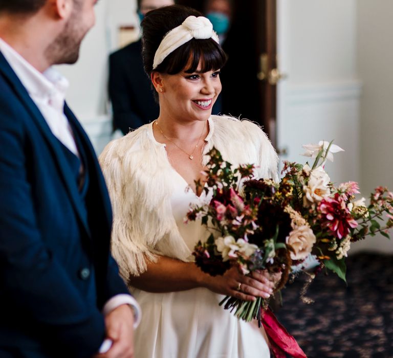 Bride with fringe and headband at micro wedding 