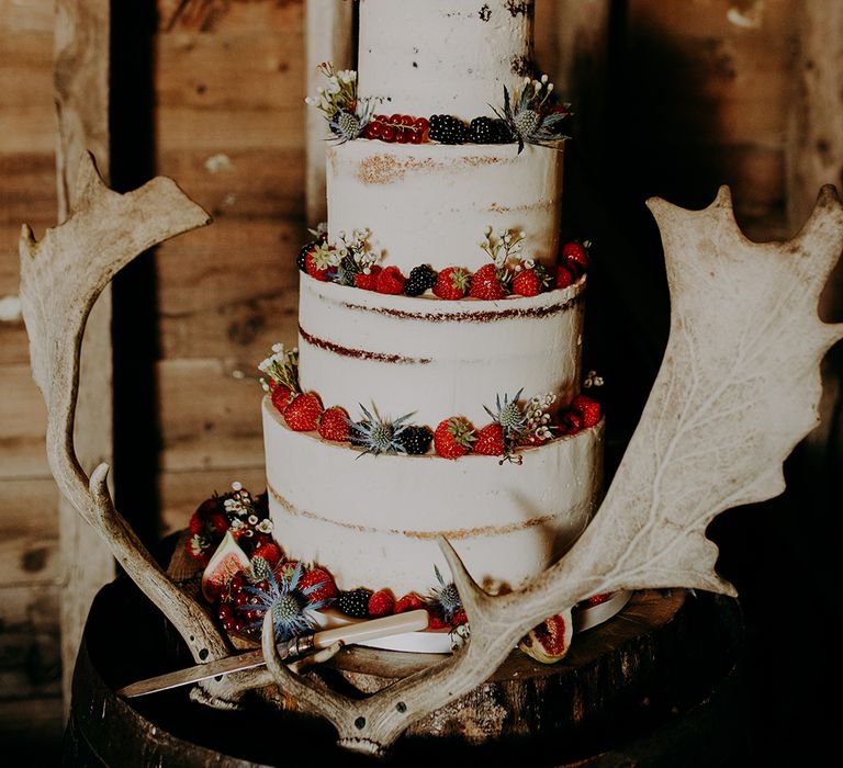 Semi naked wedding cake decorated with fruits 