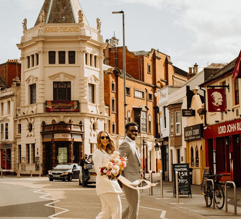 Bride and groom crossing the street in Portsmouth 