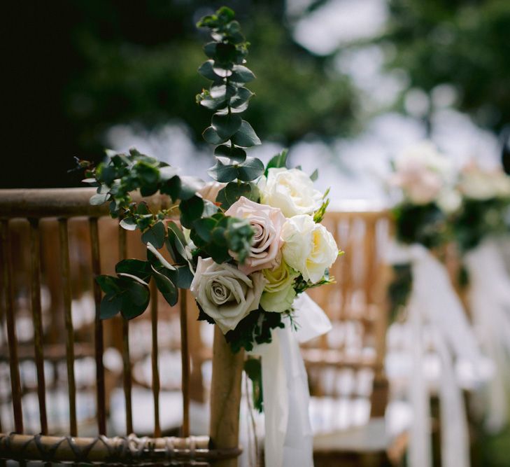 Aisle chair back flowers 