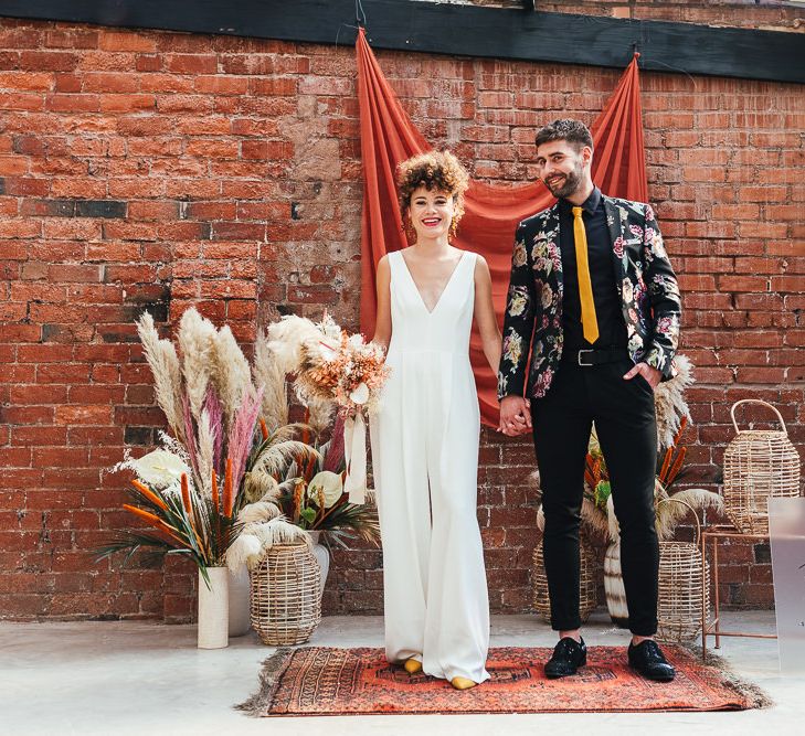 Bride and groom holding hands at The Shack Revolution wedding dress 