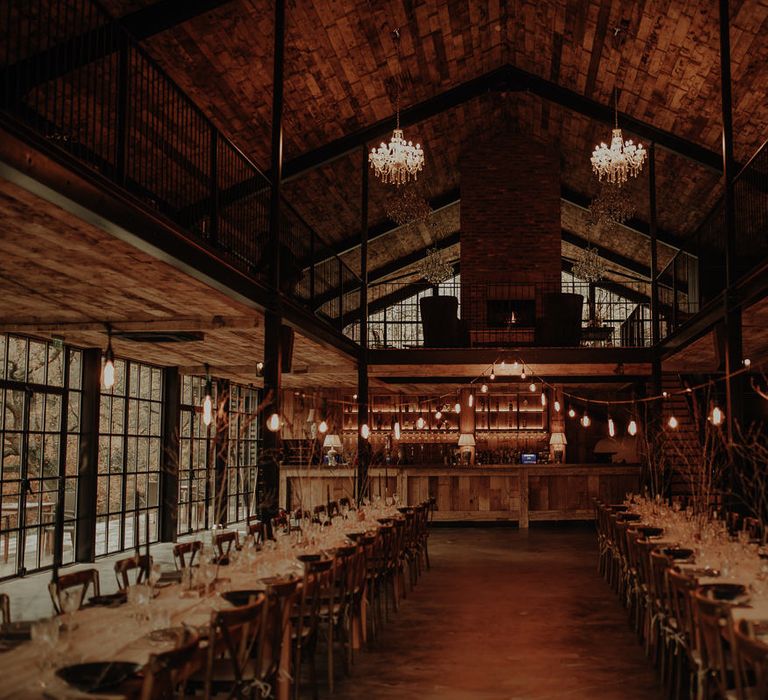 Hidden River Cabins wedding reception with banquet tables, dried flower arrangements and festoon lights 