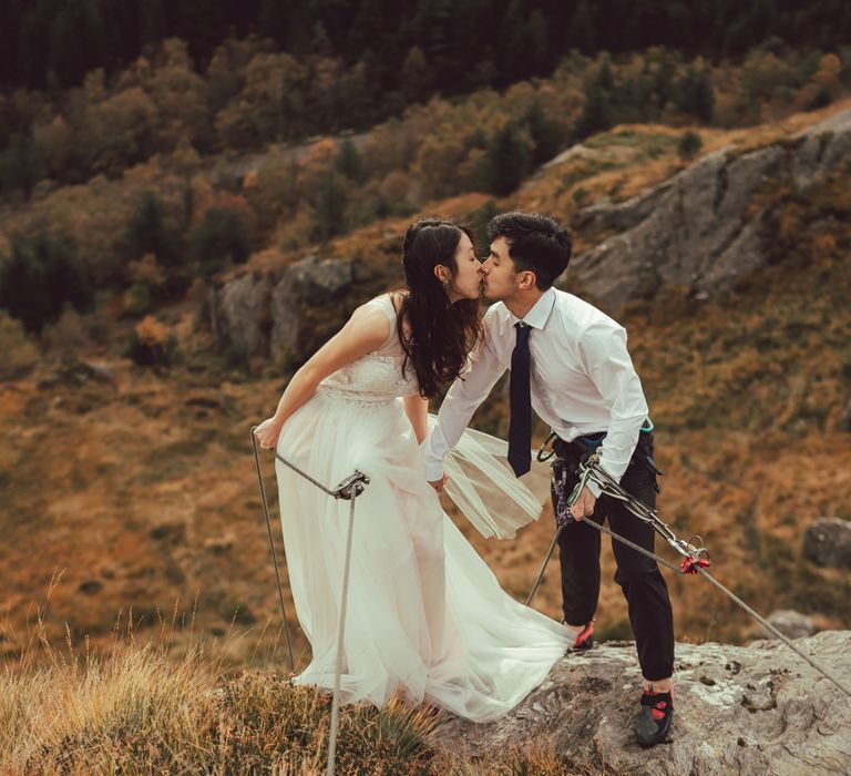 Couple kiss during engagement session in Scotland