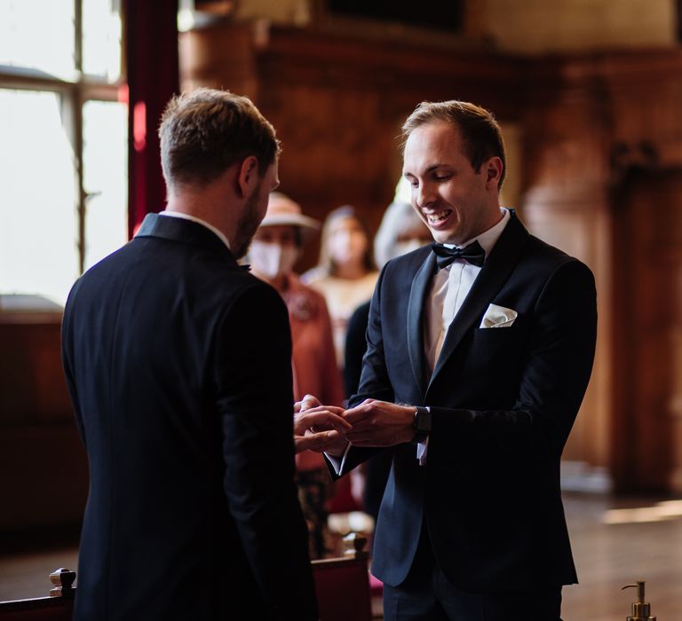 Grooms during wedding ceremony at Oxford Town Hall