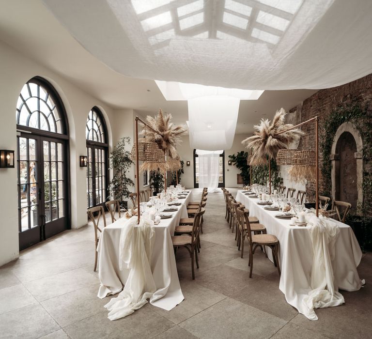 Wedding reception at Middleton Lodge with drapes, pampas grass and wicker lampshade earthy wedding decor