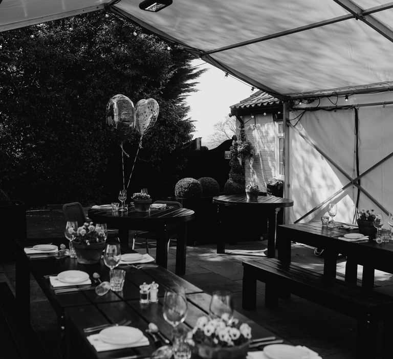 Outside wedding reception at a pub with a marquee