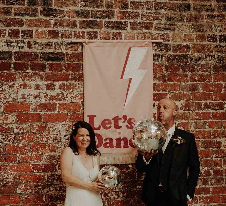 Retro wedding sign and glitter ball decor for mature couple wedding