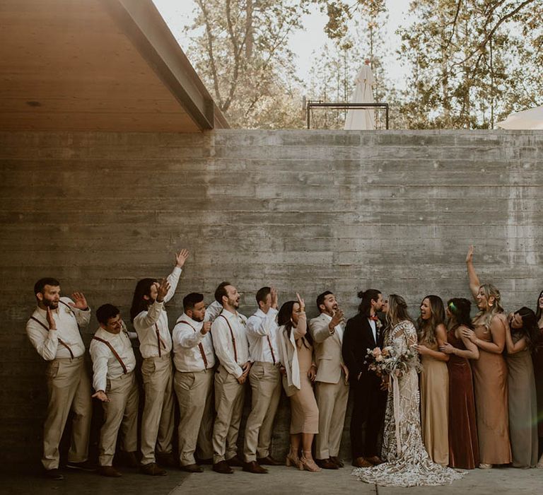 Bride & groom stand with their wedding party