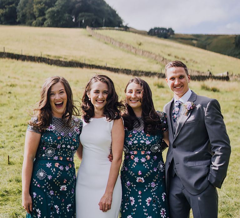 Dark blue floral embellished bridesmaid dresses with fun colourful details 