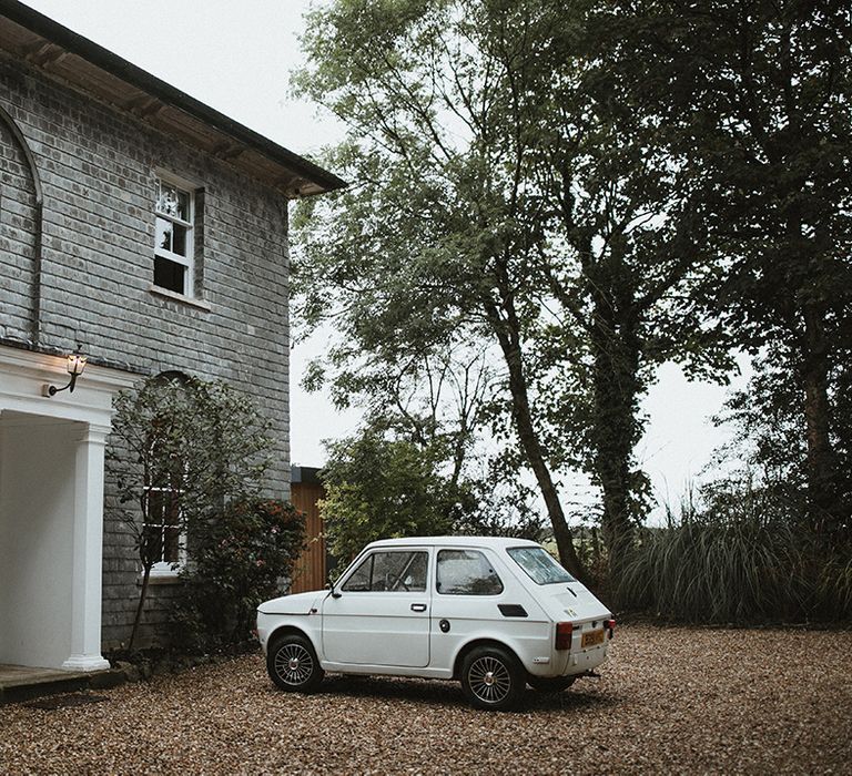 Vintage Fiat 126 beside Treseren wedding venue 