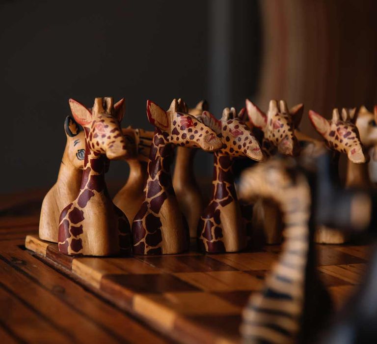 Wooden giraffe bespoke chessboard at Giraffe Manor wedding venue Kenya