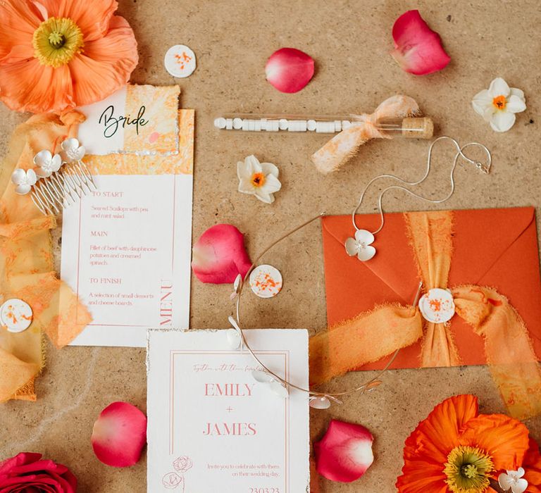 Orange and pink wedding stationery suite with the wedding invitation and menu 