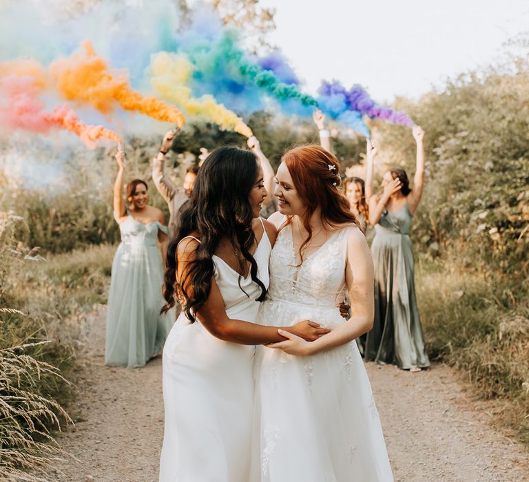 Rainbow smoke bomb wedding photo with the I Do Crew waving the smoke flares at LGBTQI+ wedding 