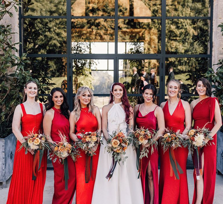 Bridal party wearing bright vibrant red bridesmaid dresses for Valentine's Day wedding ideas roundup 