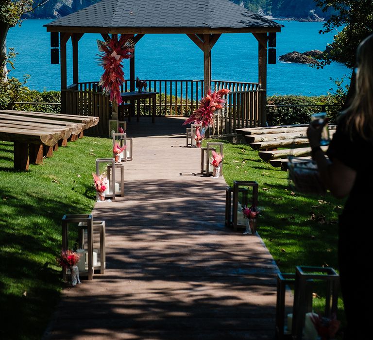 Watermouth Cove wedding venue with hot pink dried wedding flowers with pampas grass 