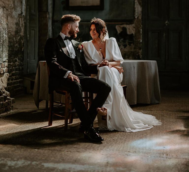 The Asylum Chapel unique and eccentric wedding venue in London with the bride and groom seated for their ceremony 