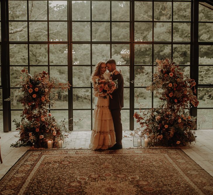 Autumn altar wedding flowers and wool rug at the Hidden River Cabins 