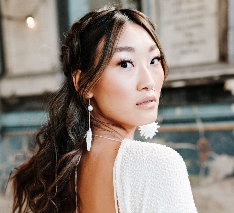 Asian bride in backless wedding dress with sequins 