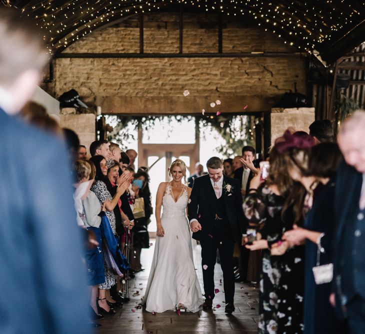 Barn wedding with ceiling festoon lighting 