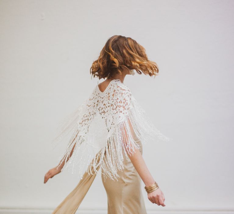 Bride twirling in gold wedding dress