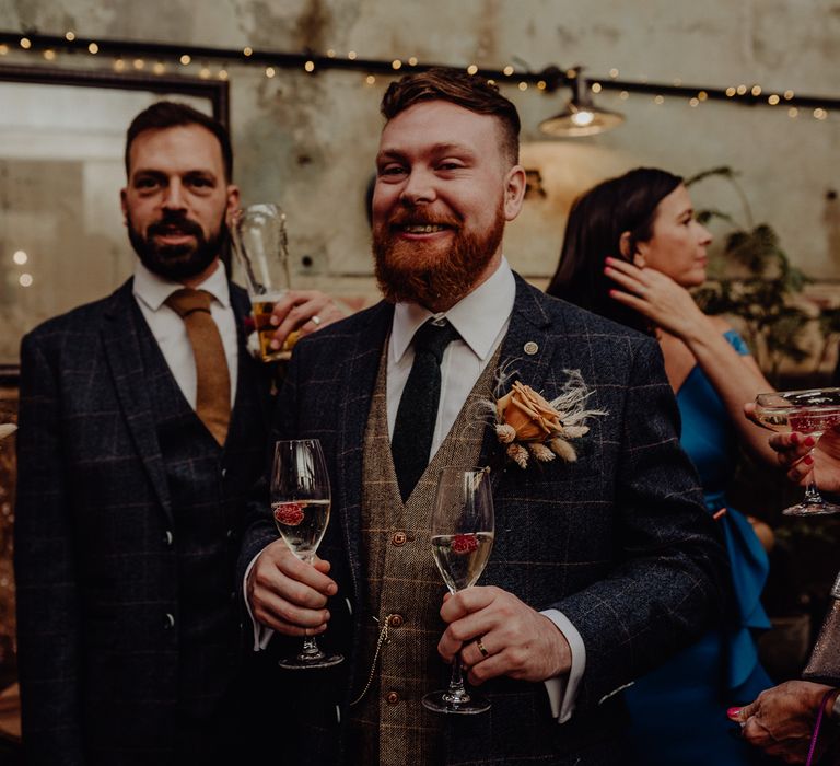 Groom in wool suit and waistcoat at vintage wedding 