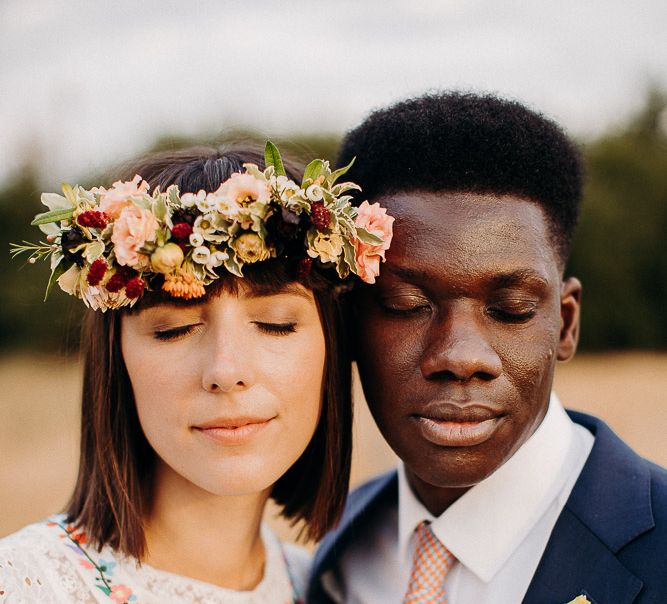 Intimate portrait of a Black British groom and White British bride 