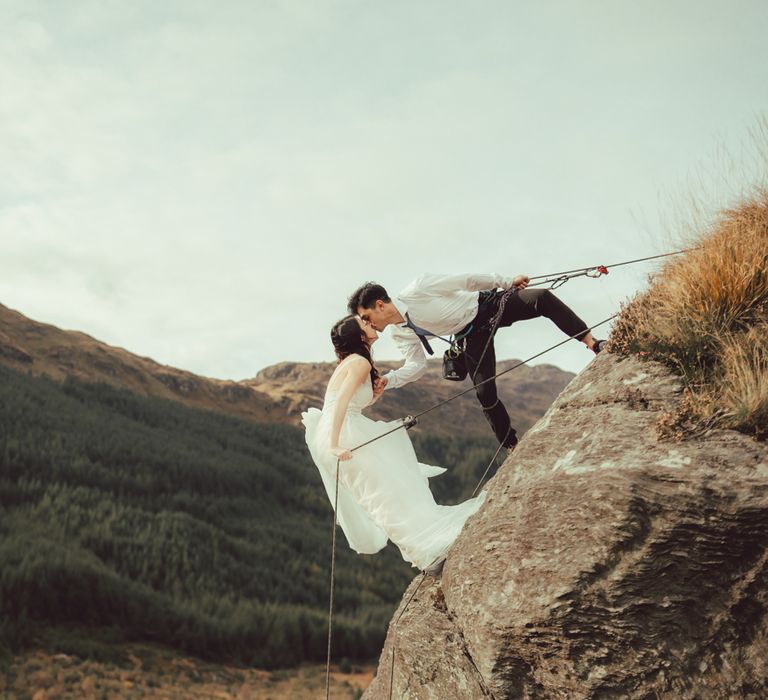 Couple during rock climbing engagement session