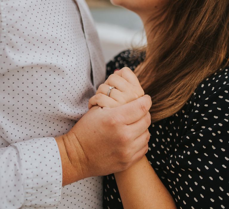 Newly engaged couple kissing