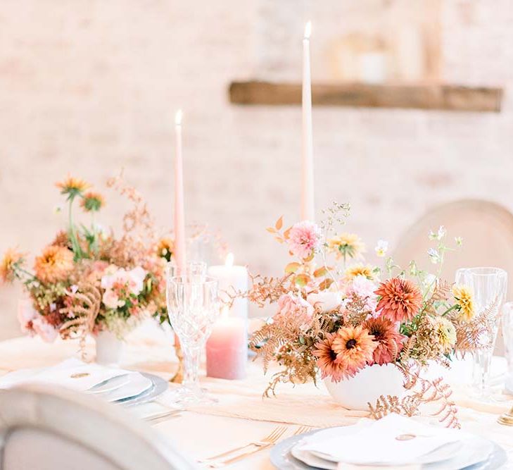 Pale orange and peach autumn wedding flower table centrepiece 