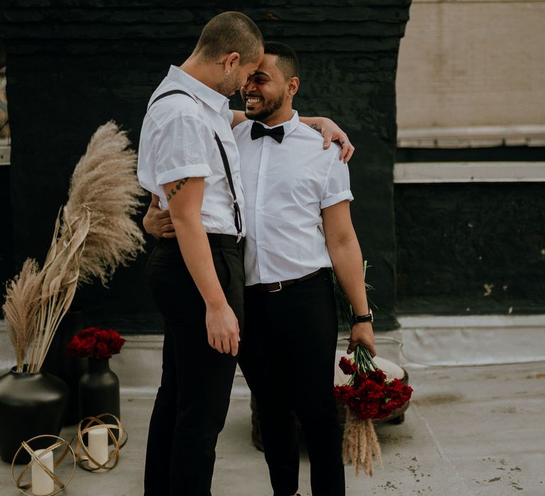 Red flowers for intimate gay elopement in New York