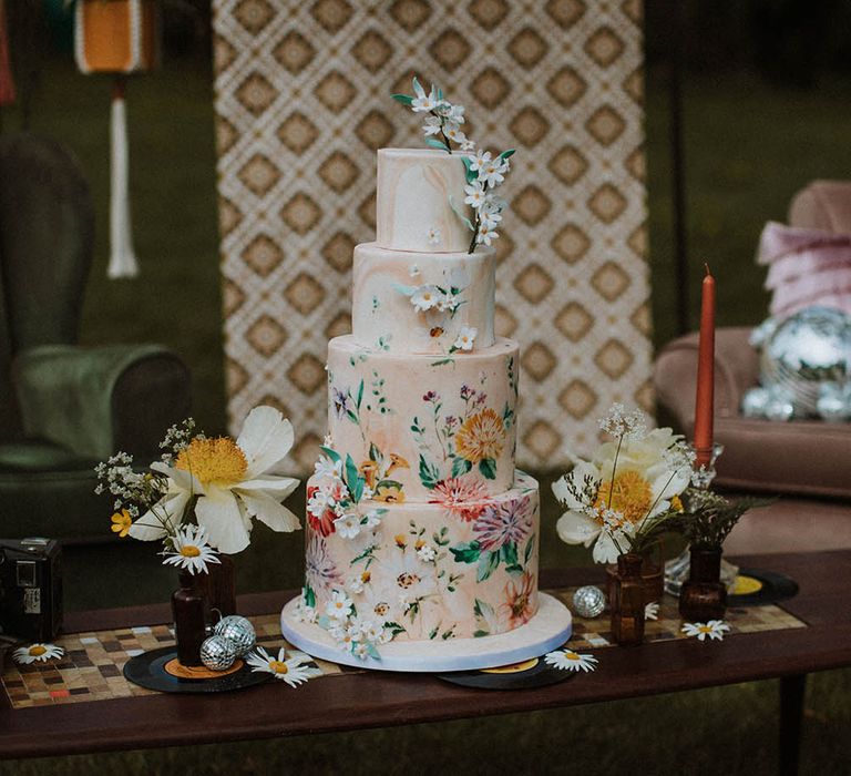 Four tier marble wedding cake with hand illustration decor for sixties wedding inspiration 