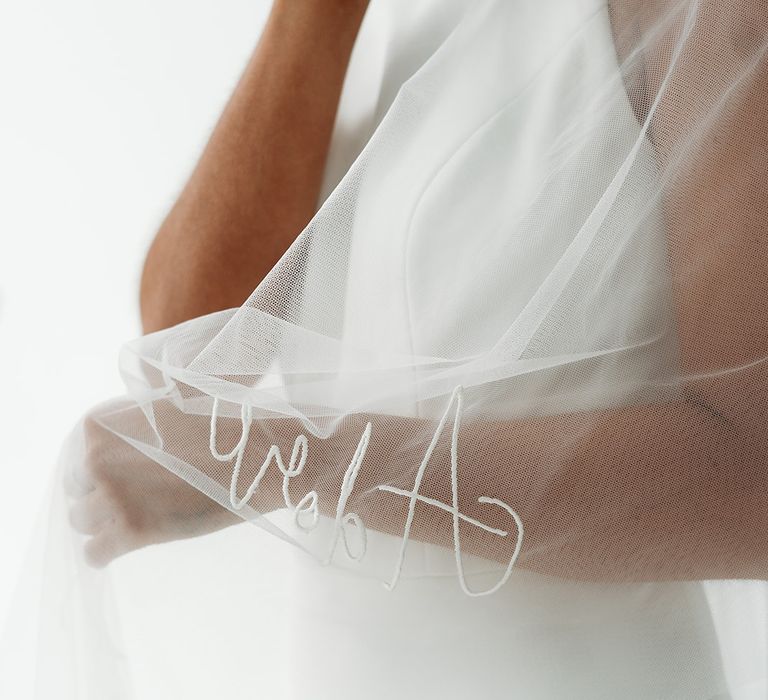 Tulle wedding veil embroidered with the word Adore