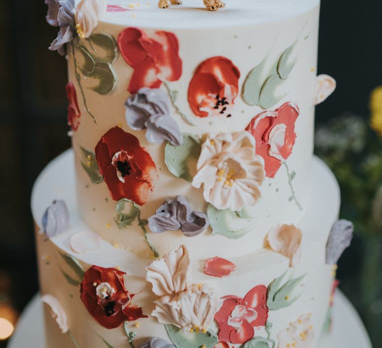 Cake with flower detail and dog cake toppers