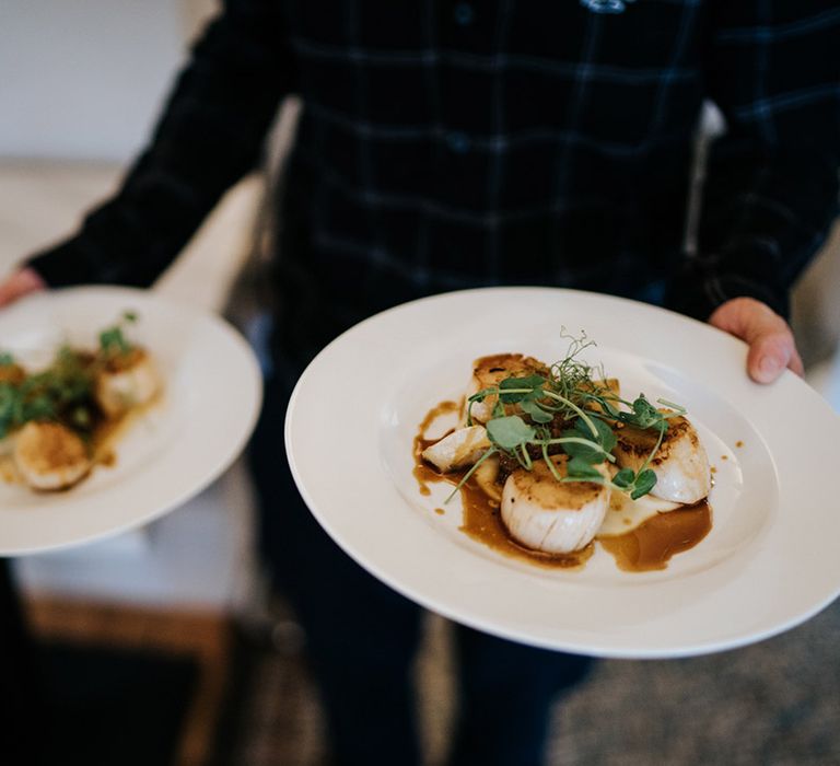 Wedding reception food - scallops finished with watercress garnish 