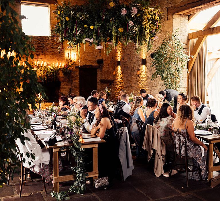 Intimate wedding at Cripps Barn with foliage and flower decor