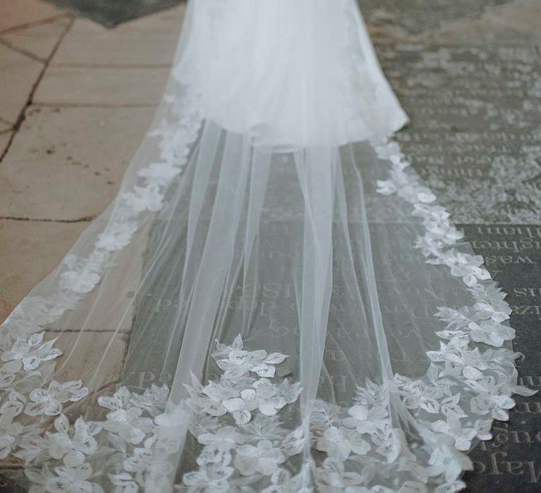 cathedral length veil with leaf appliqué design around the edge 