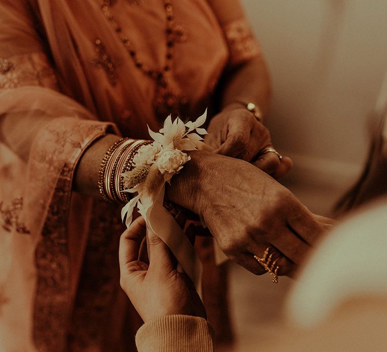 Dried flower wrist corsage for the mother of the bride 