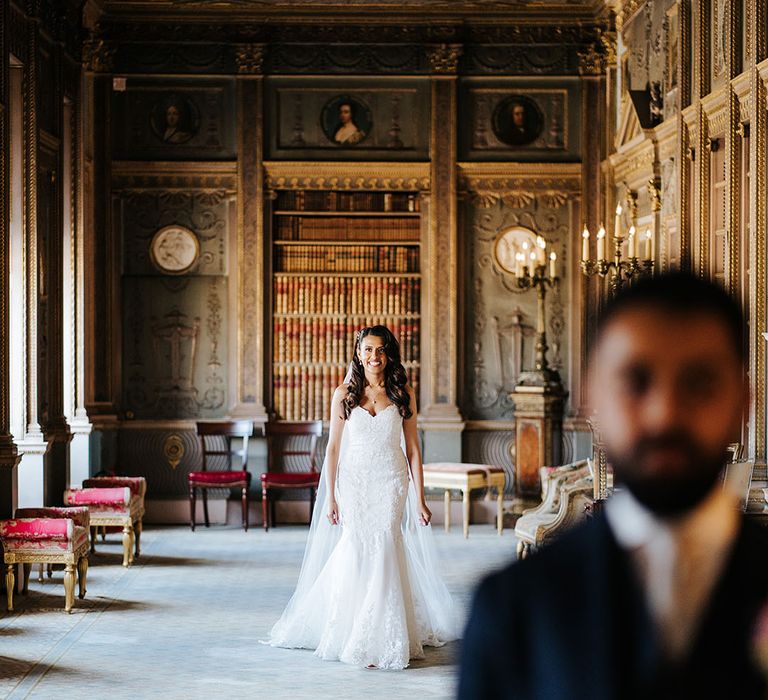 Bride walks down grand room at Syon Park before first-look moment with her groom 